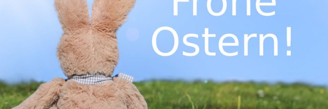 Frohe Ostern Osterhase mit Eiern auf Wiese